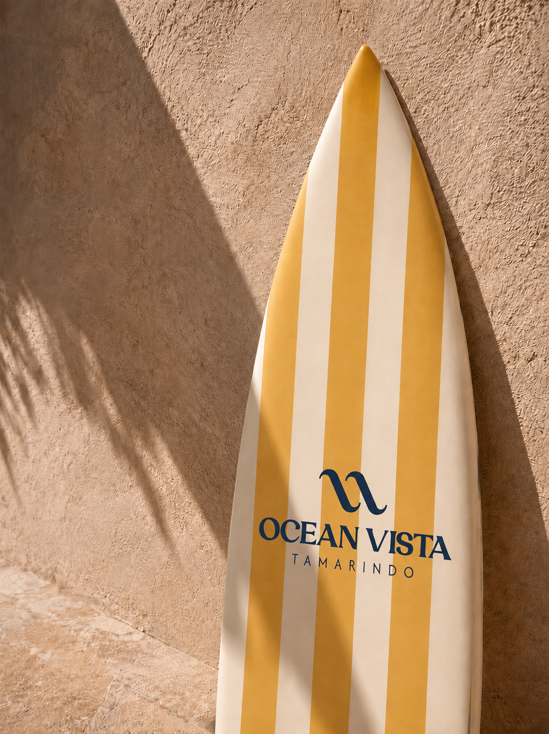 Ocean Vista branded surfboard in warm coastal light