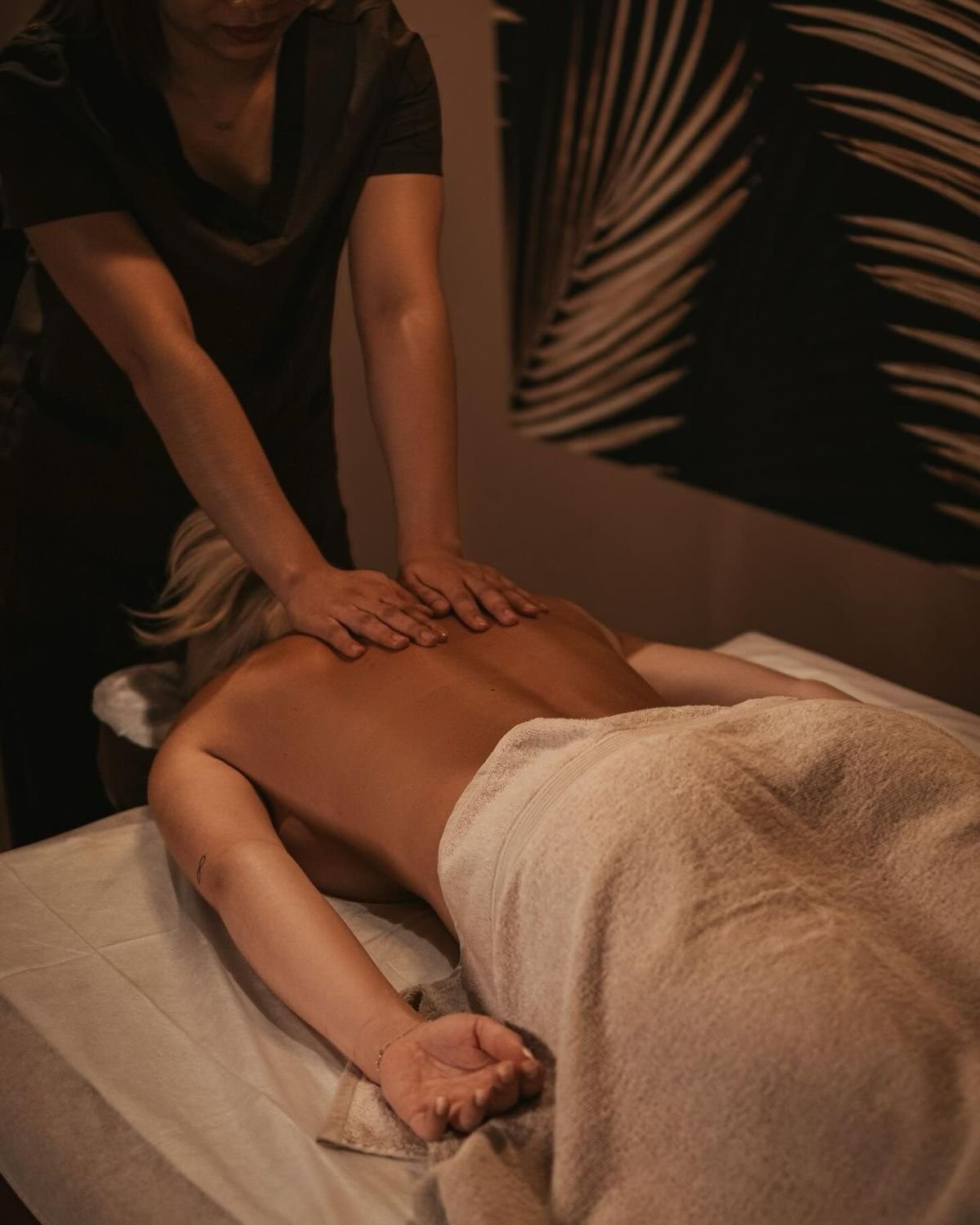 Relaxing massage service in a warm studio